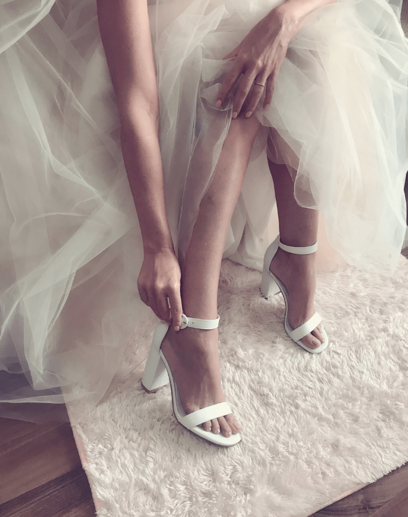 Picture of a woman wearing white high heels